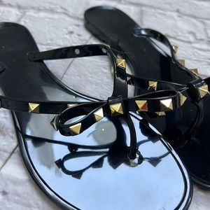 Black & gold studded flip flops